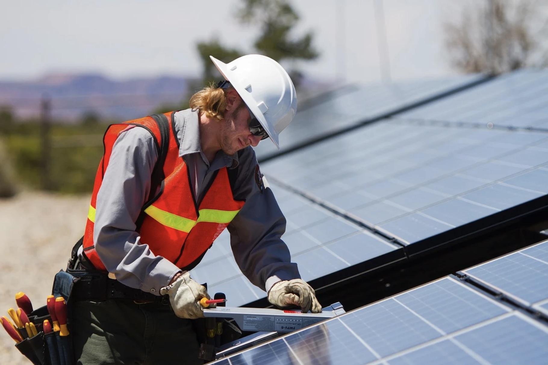 man-installing-solar-panels-on-roof (1) man-installing-solar-panels-on-roof (1)